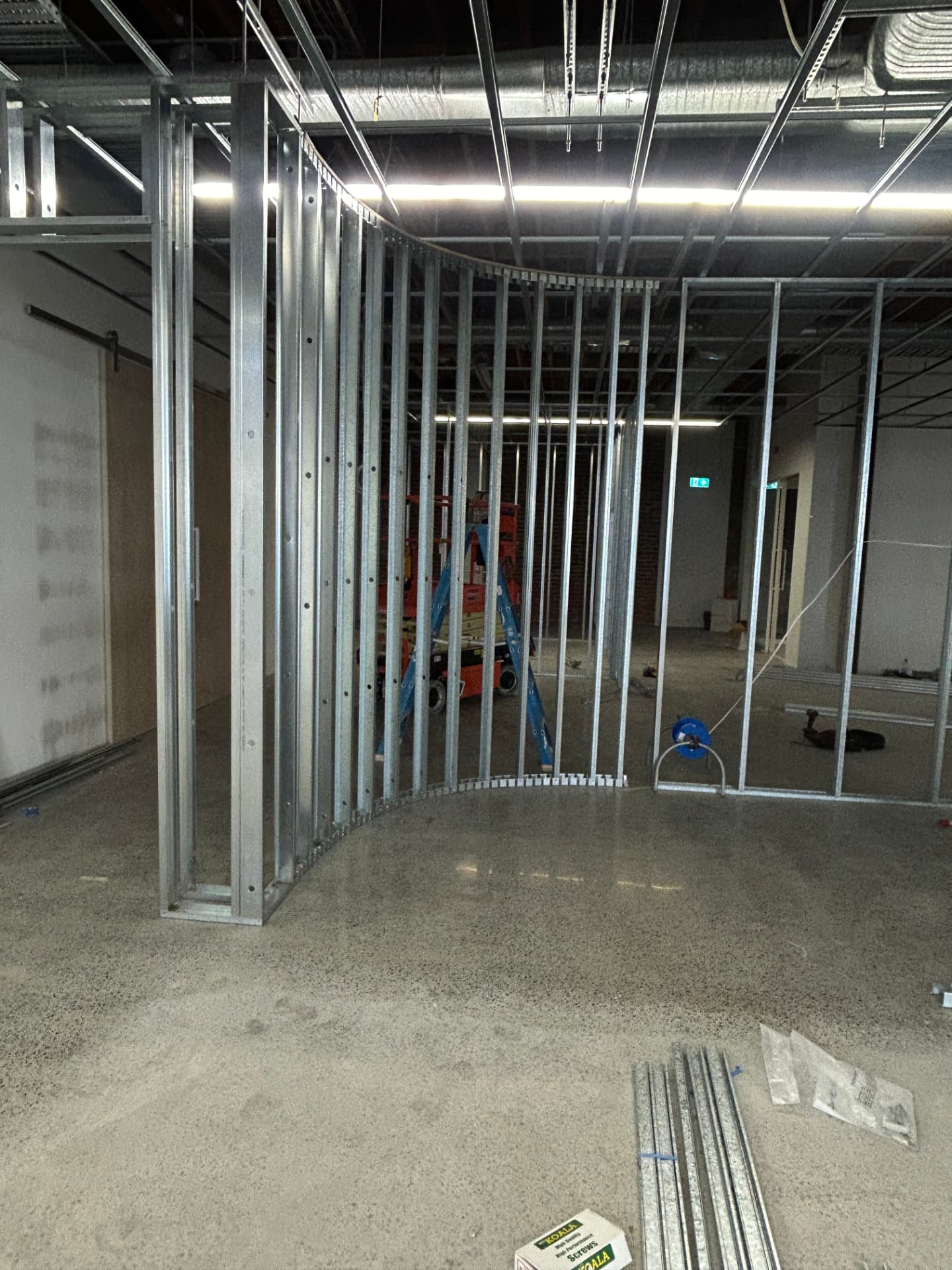 Curved steel stud framing set out for a feature plasterboard wall
