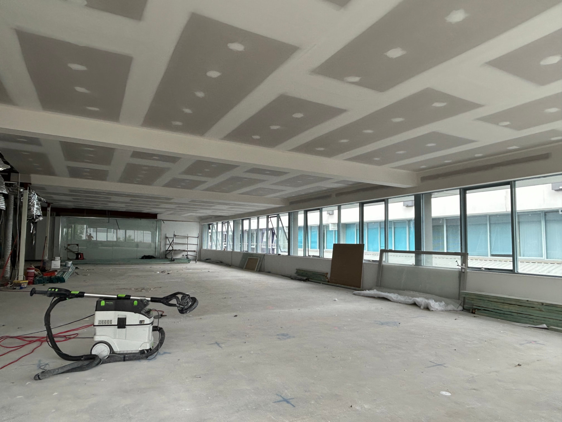 Large commercial fit-out with a finished coffered plasterboard ceiling and detailed bulkhead